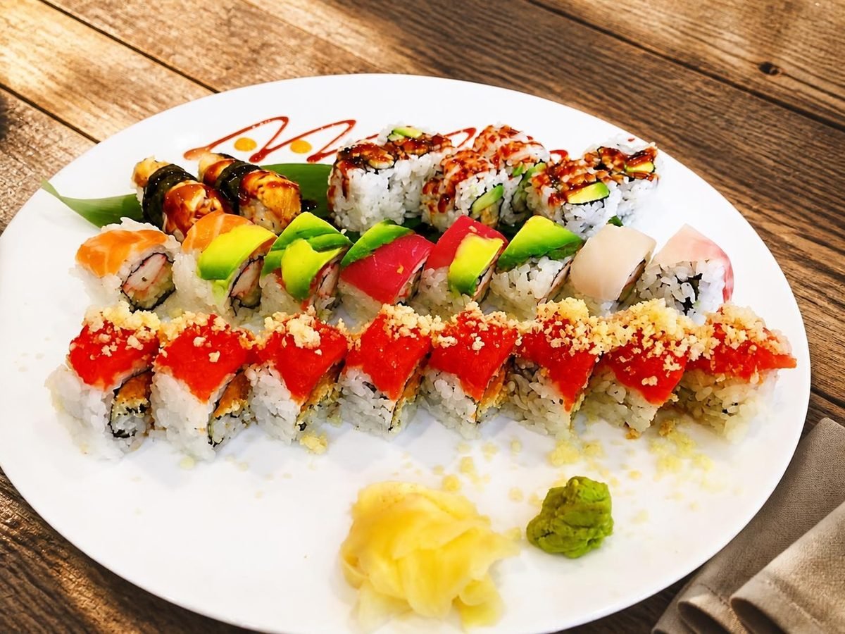 A platter of chef’s special rolls topped with tobiko, avocado and eel